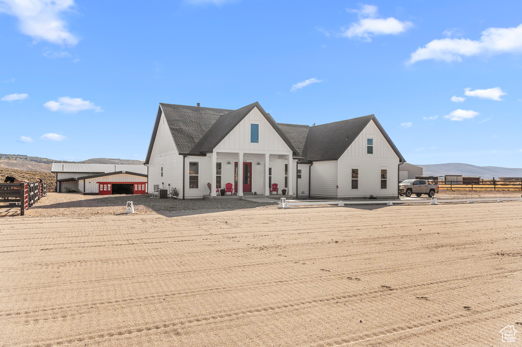 View of front of house featuring board and batten siding and a mountain view