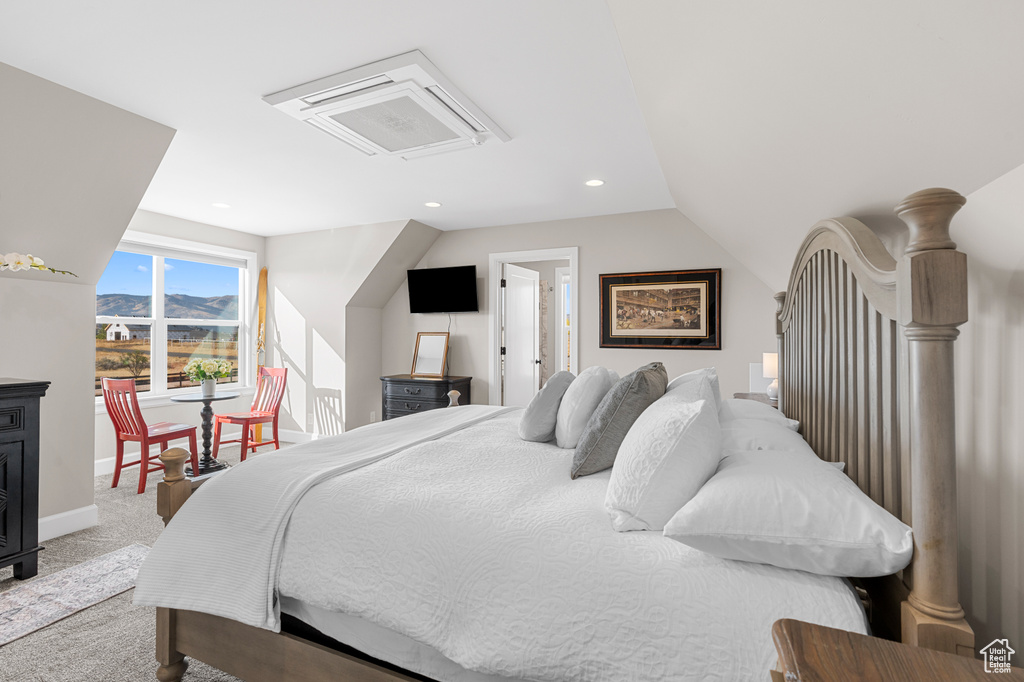 Bedroom featuring carpet, vaulted ceiling, recessed lighting, and baseboards