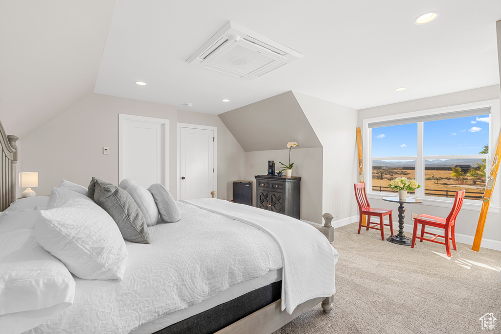 Bedroom with baseboards, carpet floors, lofted ceiling, and recessed lighting
