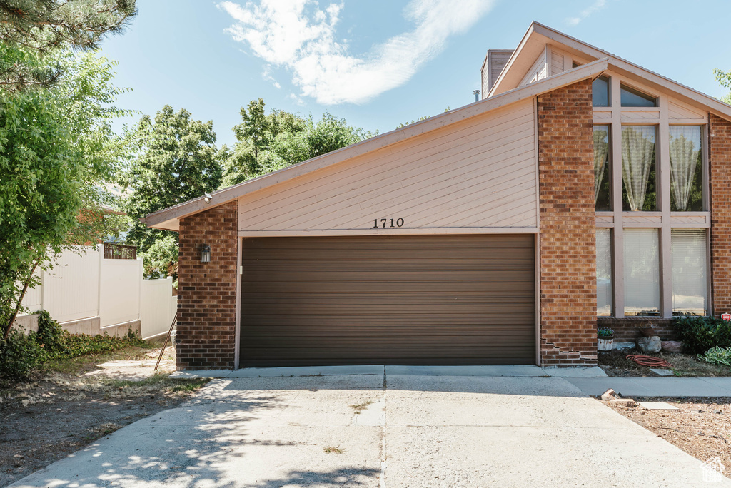 Garage featuring driveway