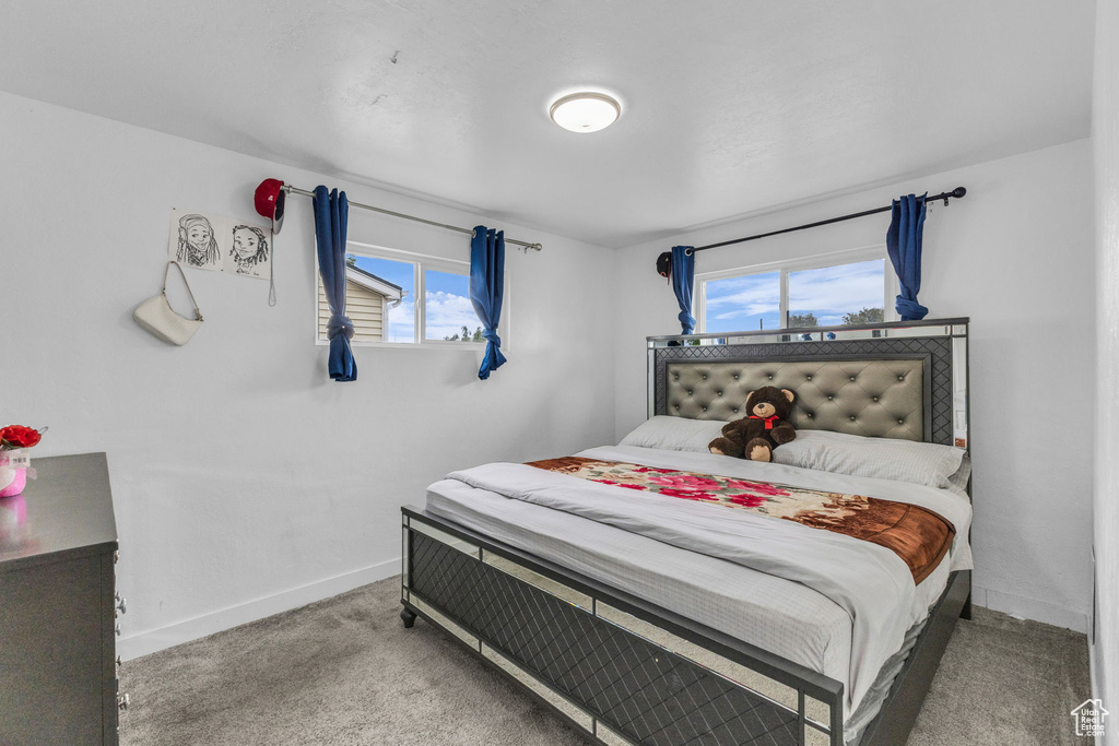 Carpeted bedroom with baseboards