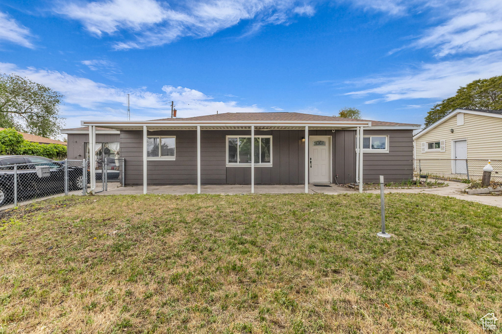 Back of house featuring a patio area and board and batten siding
