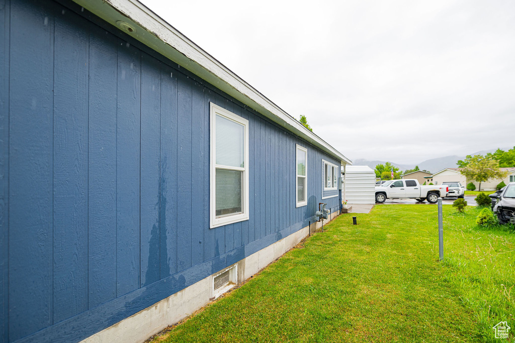 View of home\'s exterior featuring a lawn