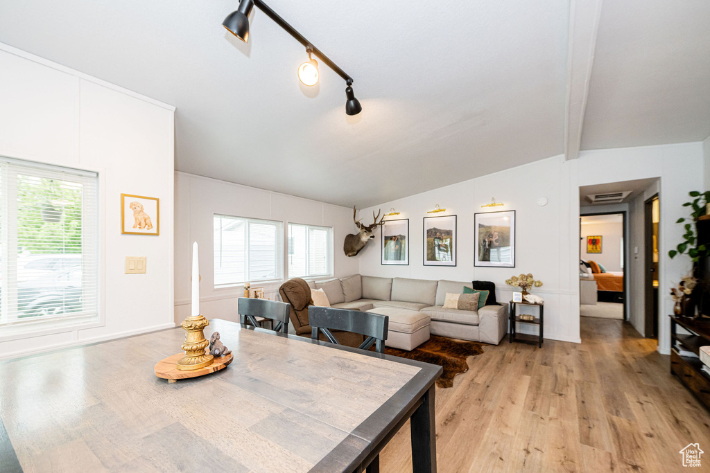 Dining area featuring light wood-type flooring and plenty of natural light