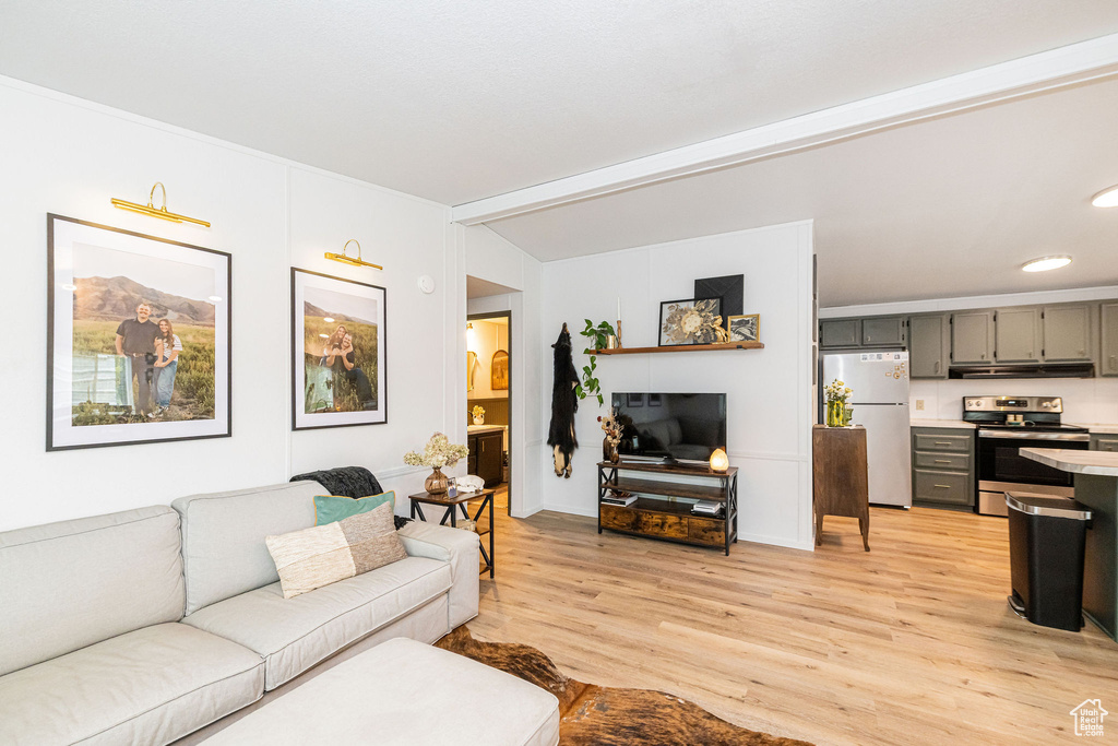 Living room featuring light wood-style floors and recessed lighting