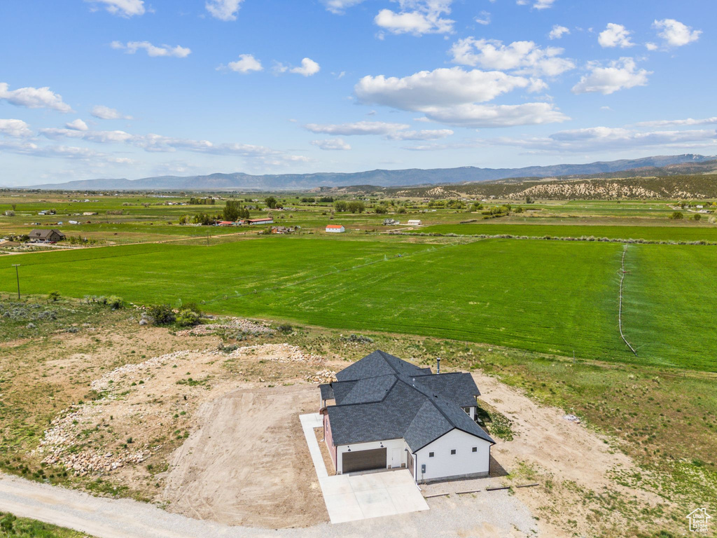 Overview of rural landscape featuring a mountain backdrop