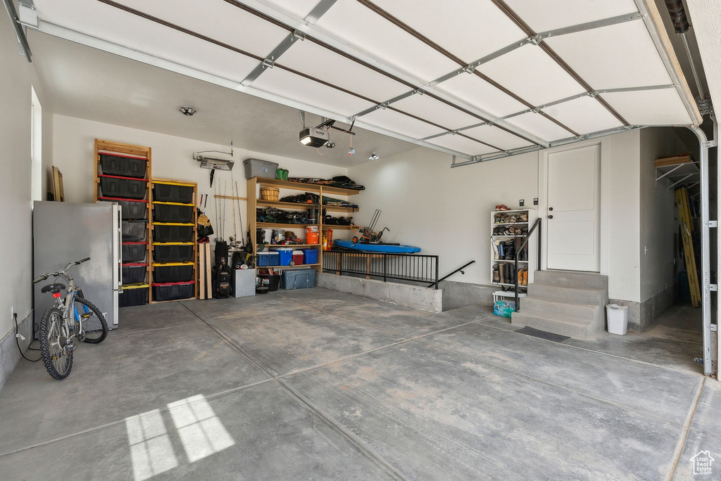 Garage featuring a garage door opener