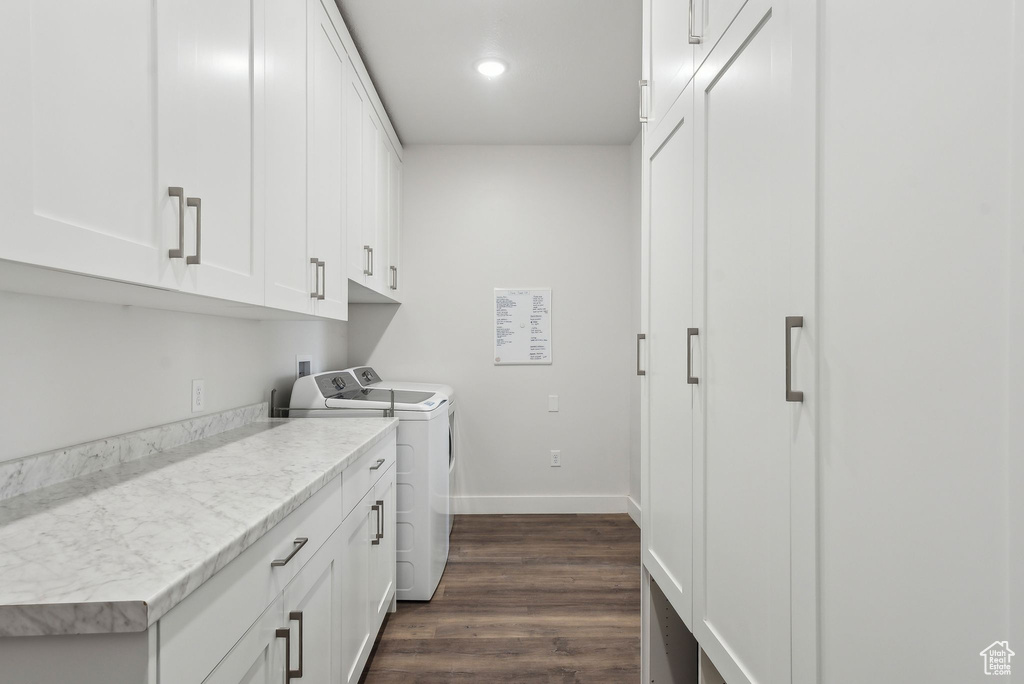 Clothes washing area with cabinet space, independent washer and dryer, dark wood-style floors, baseboards, and recessed lighting