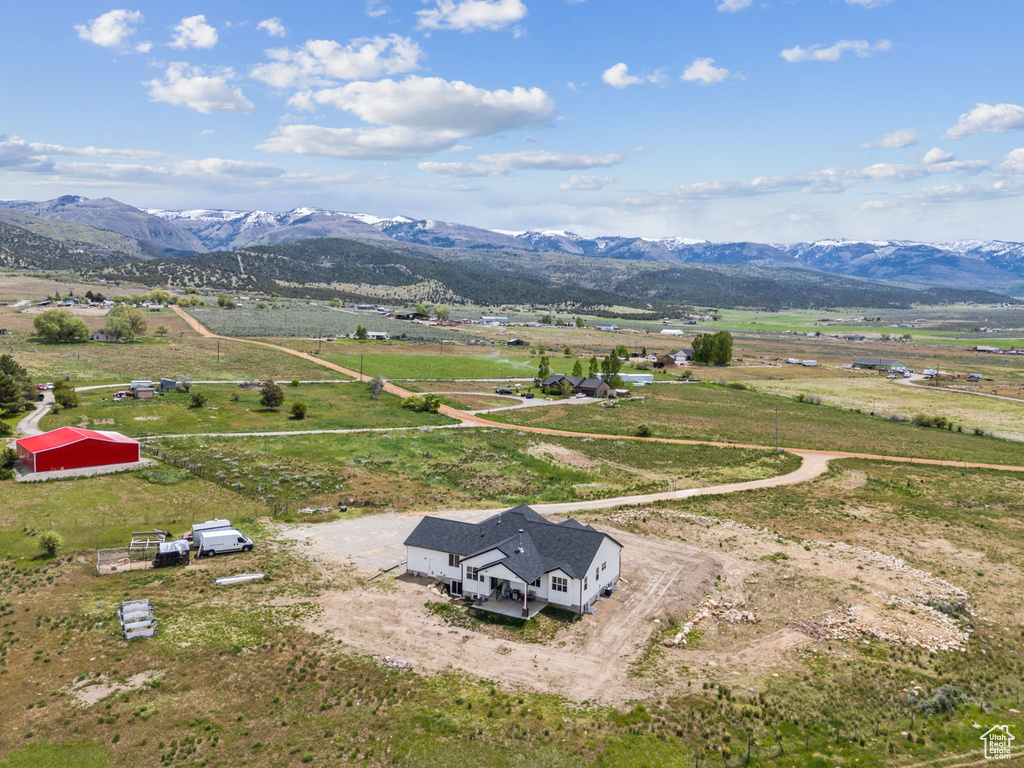 Overview of rural landscape with a mountain backdrop