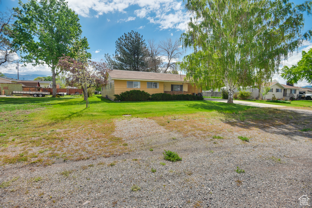 View of front of property with a front yard