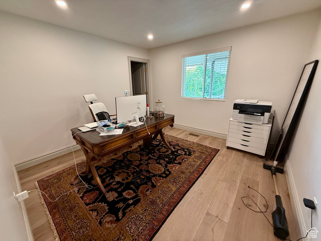 Office featuring light wood-style floors, recessed lighting, and baseboards