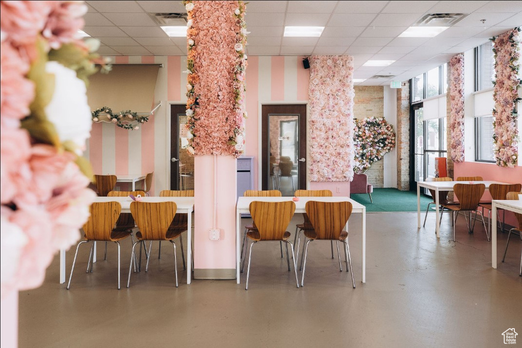 Building lobby with a paneled ceiling and a high ceiling