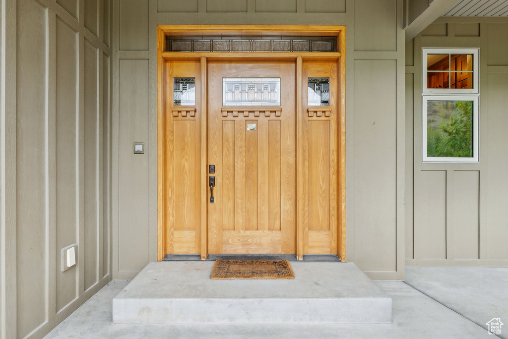 Doorway to property with board and batten siding