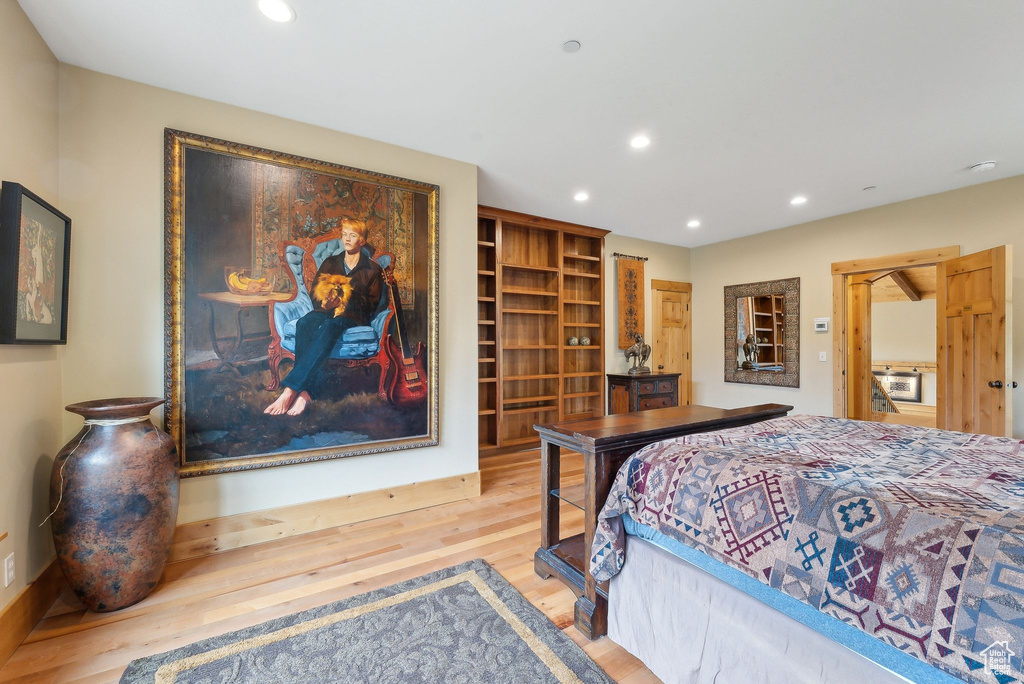 Bedroom featuring wood finished floors and recessed lighting