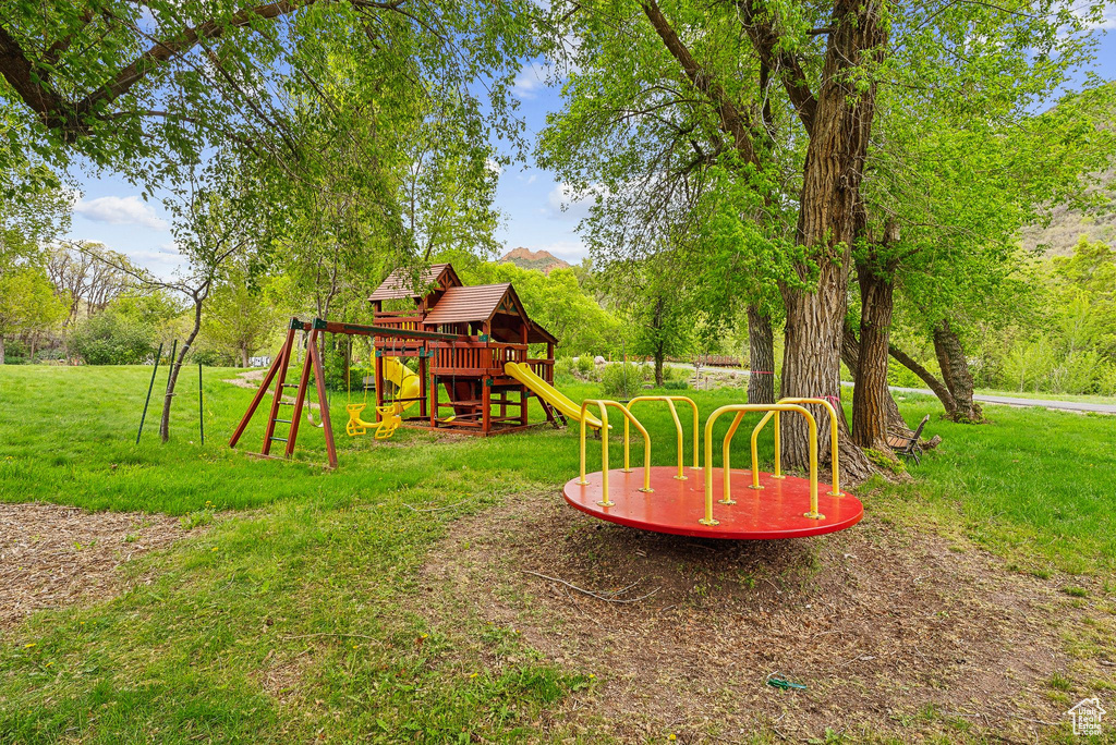 View of green lawn with a playground