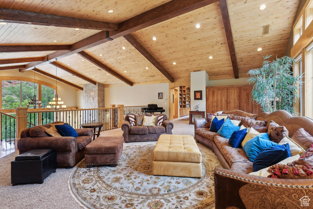 Carpeted living area with wooden ceiling, a chandelier, and recessed lighting