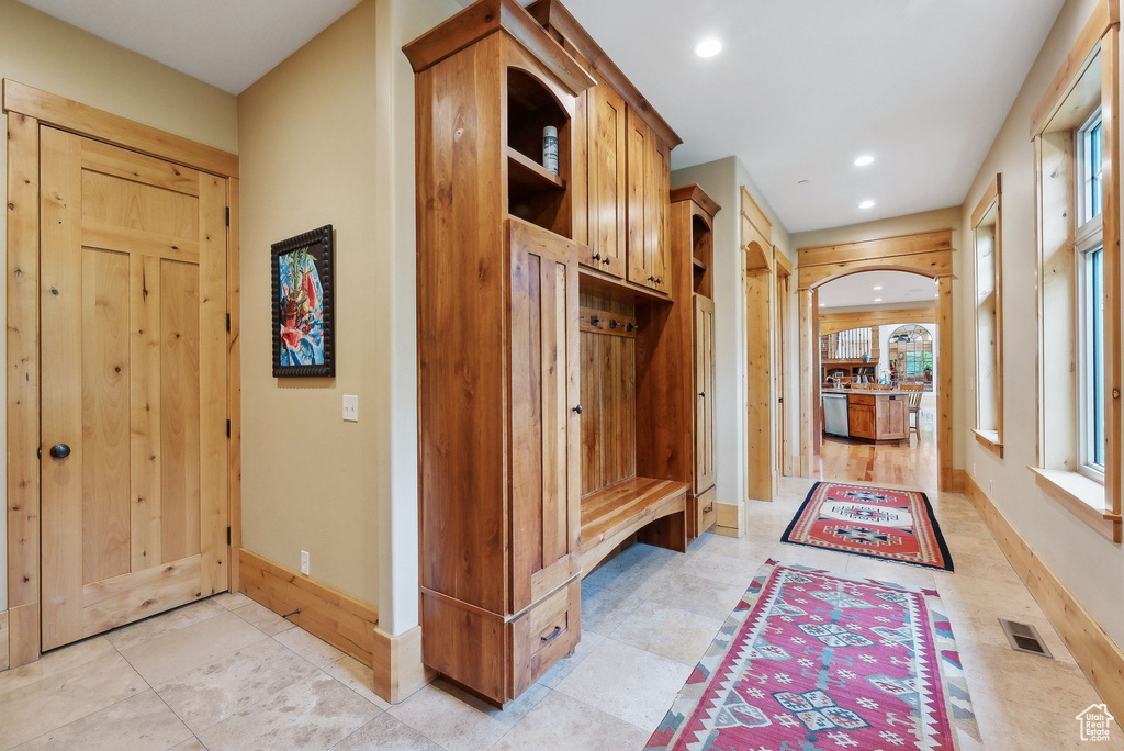 Mudroom featuring baseboards and recessed lighting