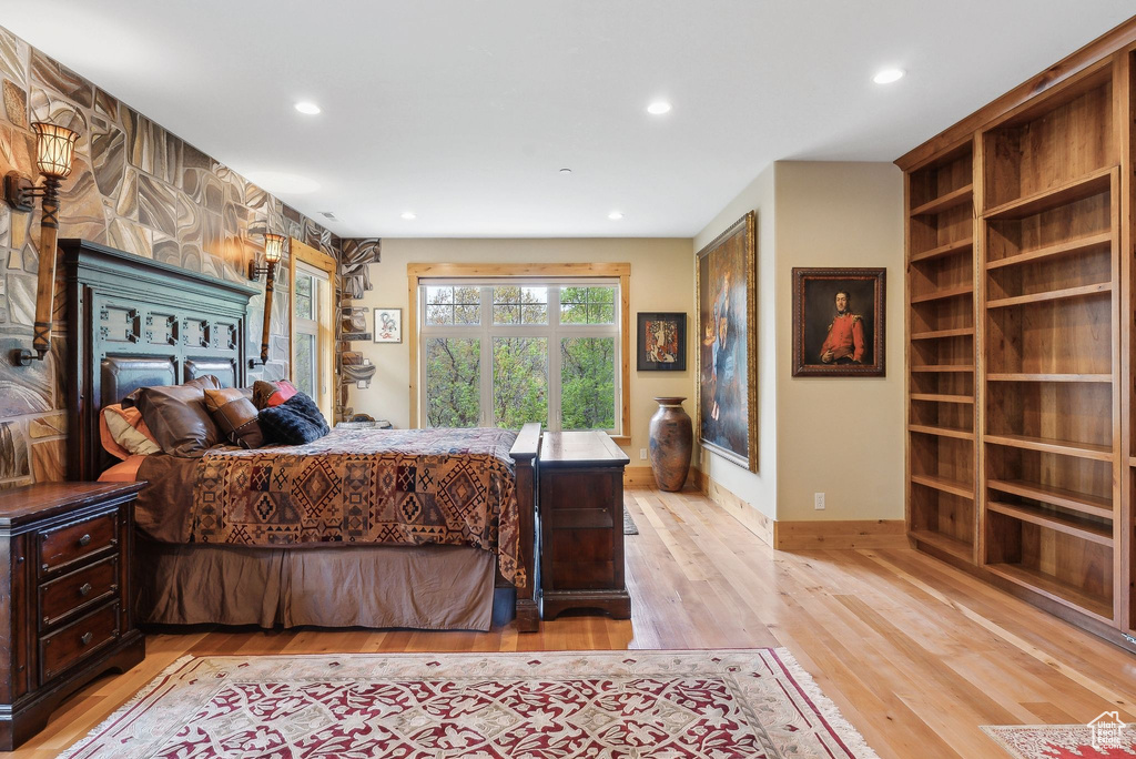 Bedroom with recessed lighting, light wood-style flooring, and baseboards