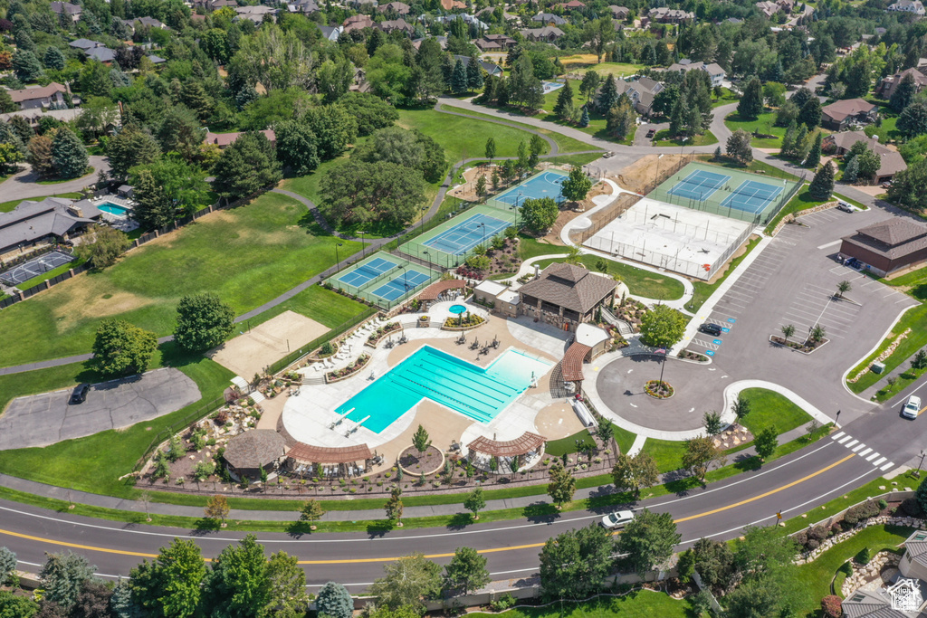 Aerial view of property and surrounding area featuring a pool area