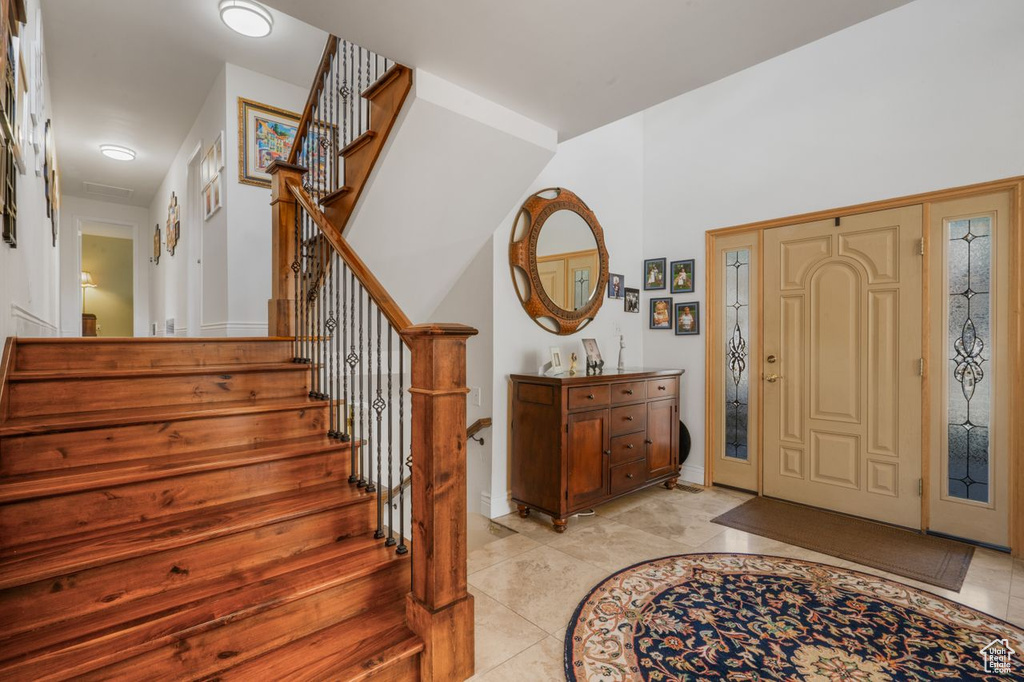 Entryway featuring stairs
