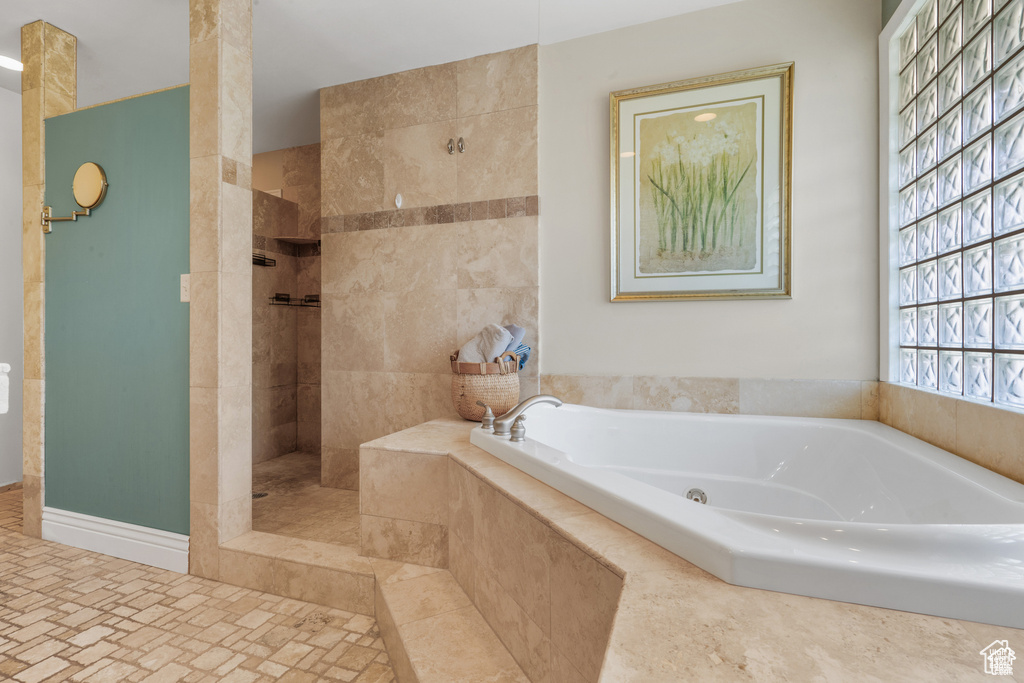 Full bath with a garden tub and walk in shower