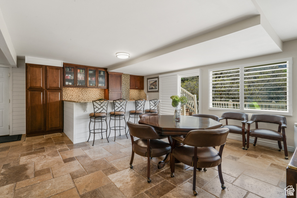 Dining room featuring stone tile floors