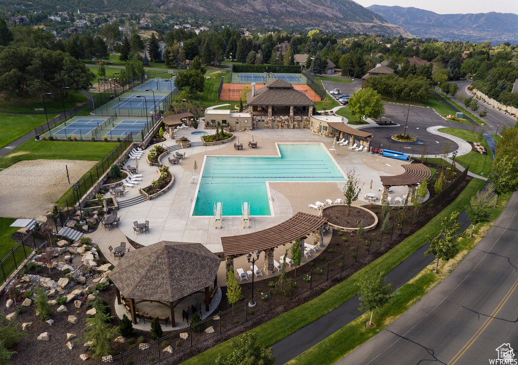 Community pool with a mountain view