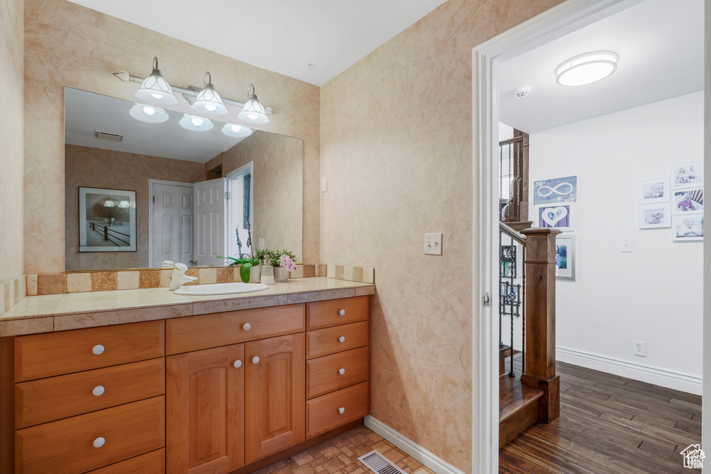 Bathroom with baseboards and vanity