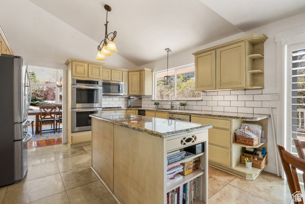 Kitchen featuring open shelves, appliances with stainless steel finishes, tasteful backsplash, a sink, and vaulted ceiling
