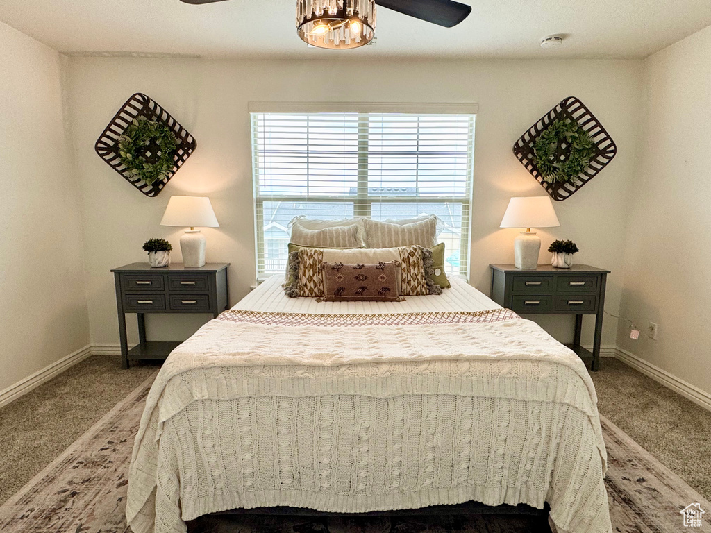 Bedroom with carpet floors and baseboards