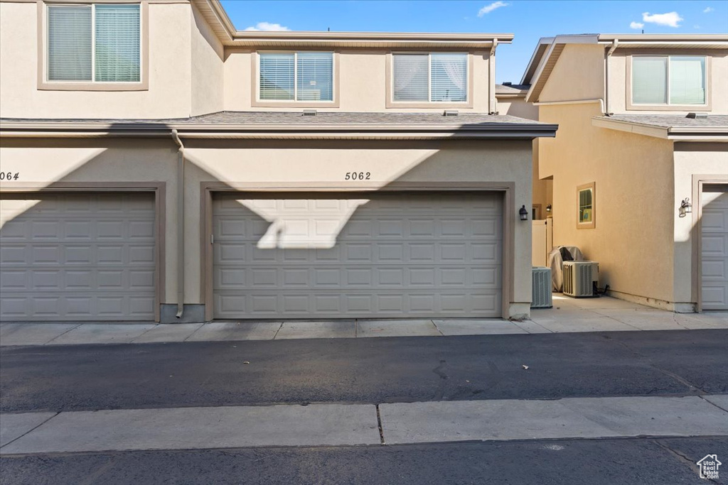 Garage featuring central air condition unit
