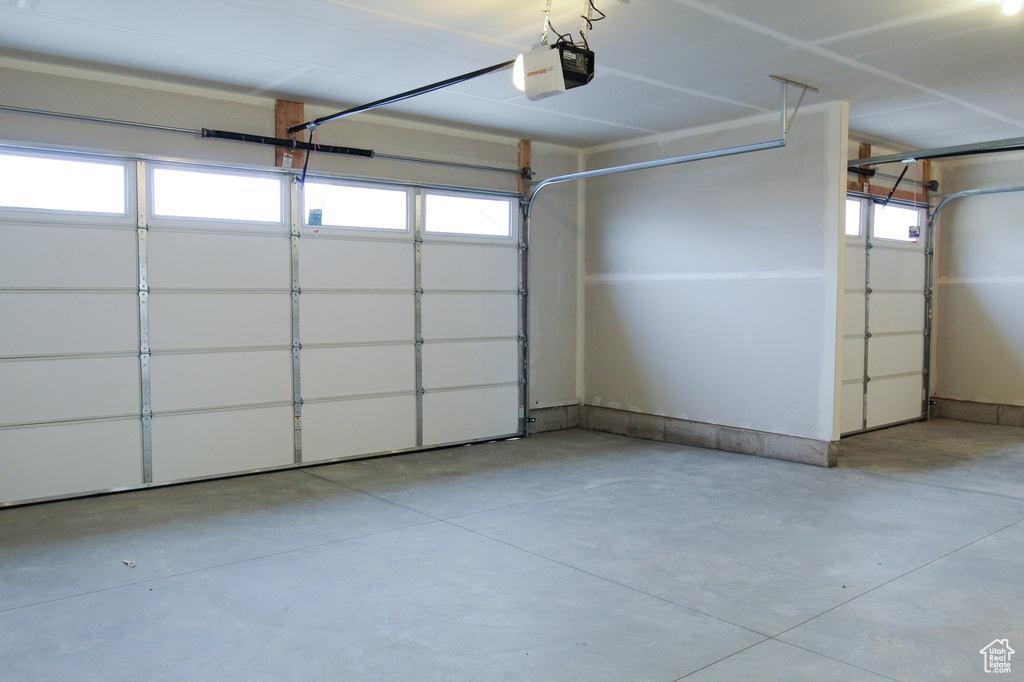 Garage featuring a garage door opener
