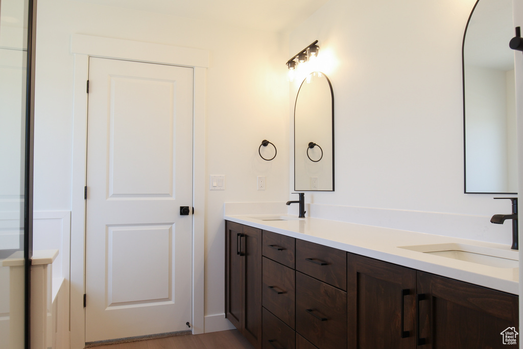 Full bathroom featuring double vanity