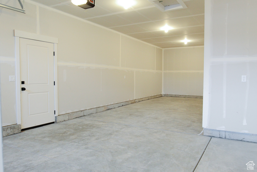 Garage featuring a garage door opener