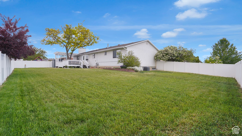 Rear view of property featuring a deck