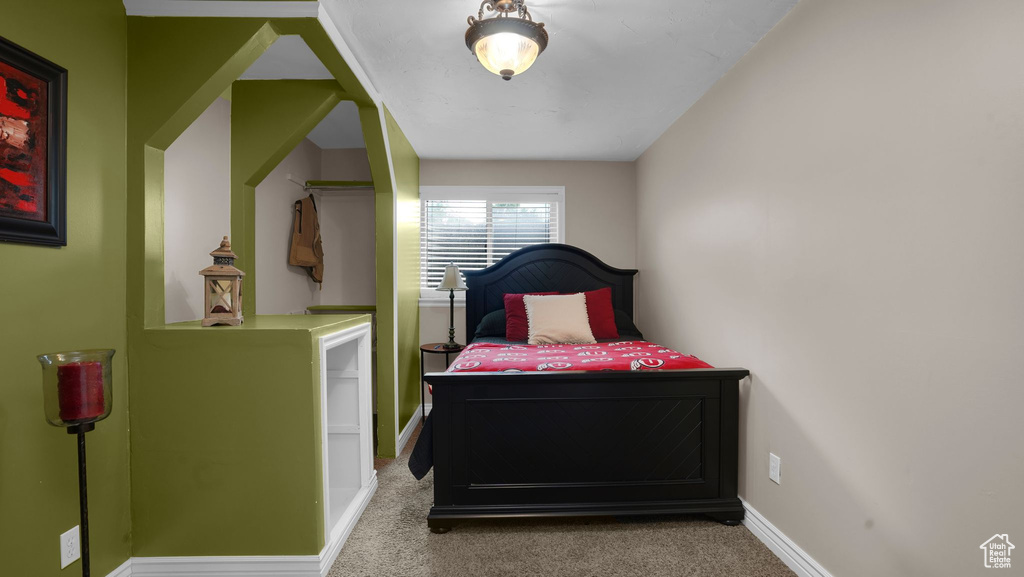 Bedroom with carpet and baseboards