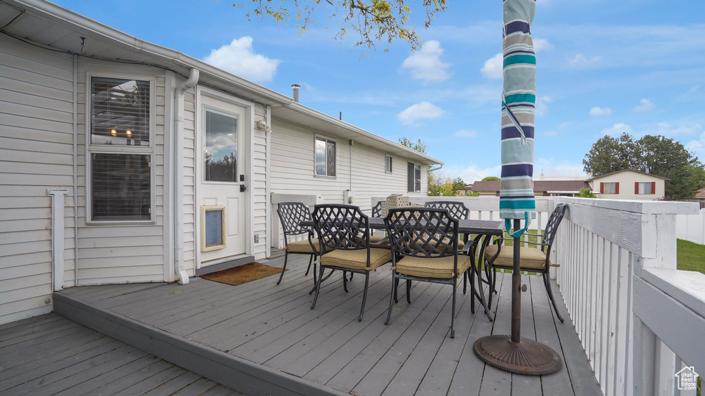Wooden deck with outdoor dining space