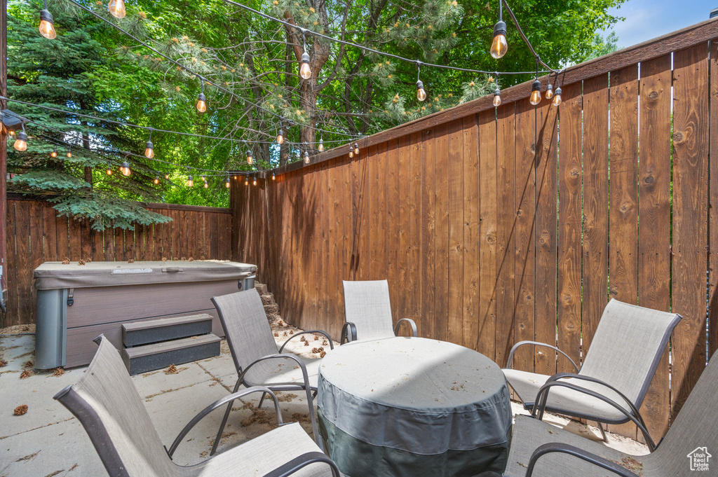 View of patio featuring a hot tub