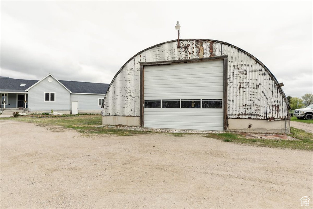 Detached garage featuring driveway