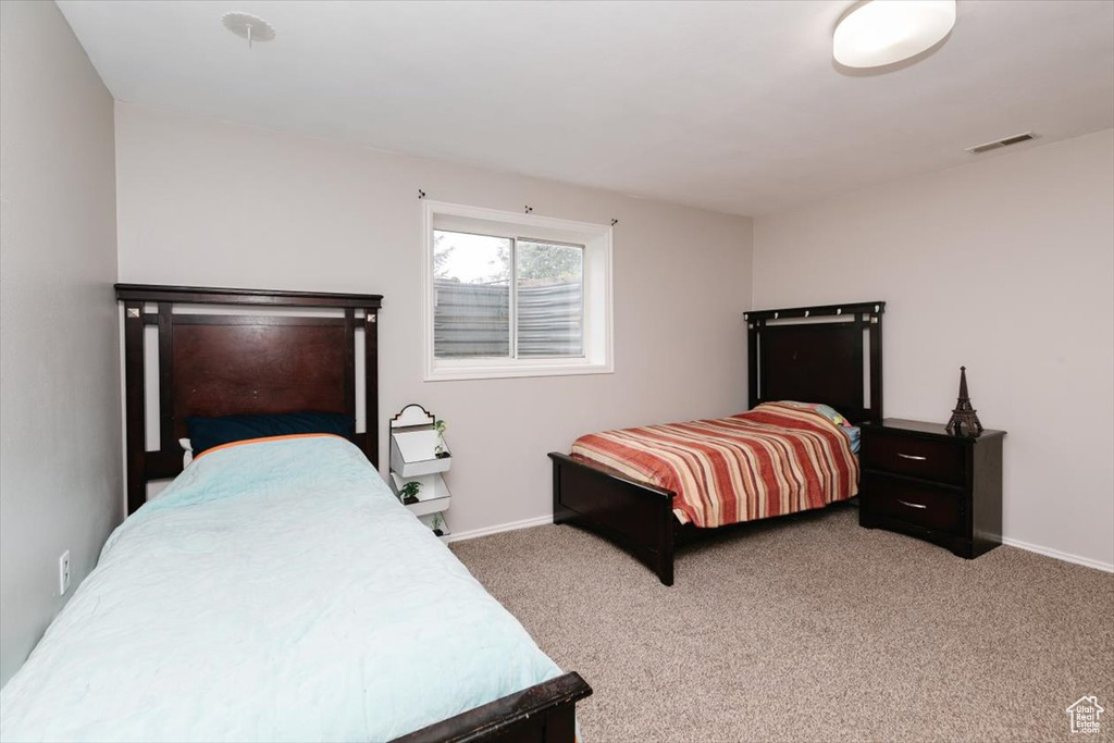 Carpeted bedroom with baseboards