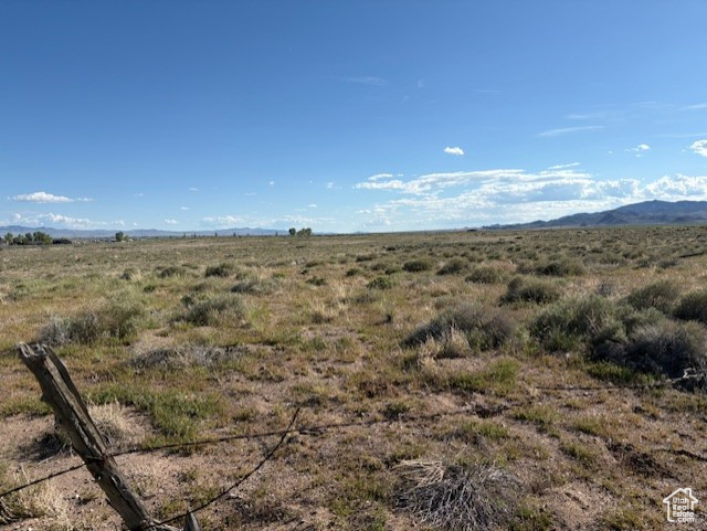 View of mountain background featuring rural landscape