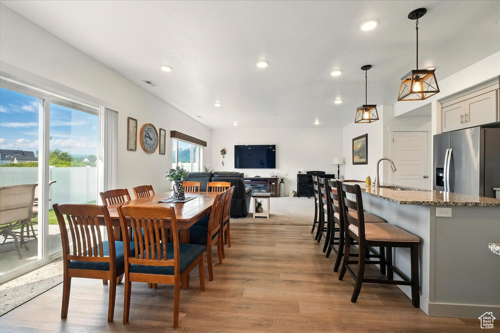 Dining room featuring recessed lighting and wood finished floors