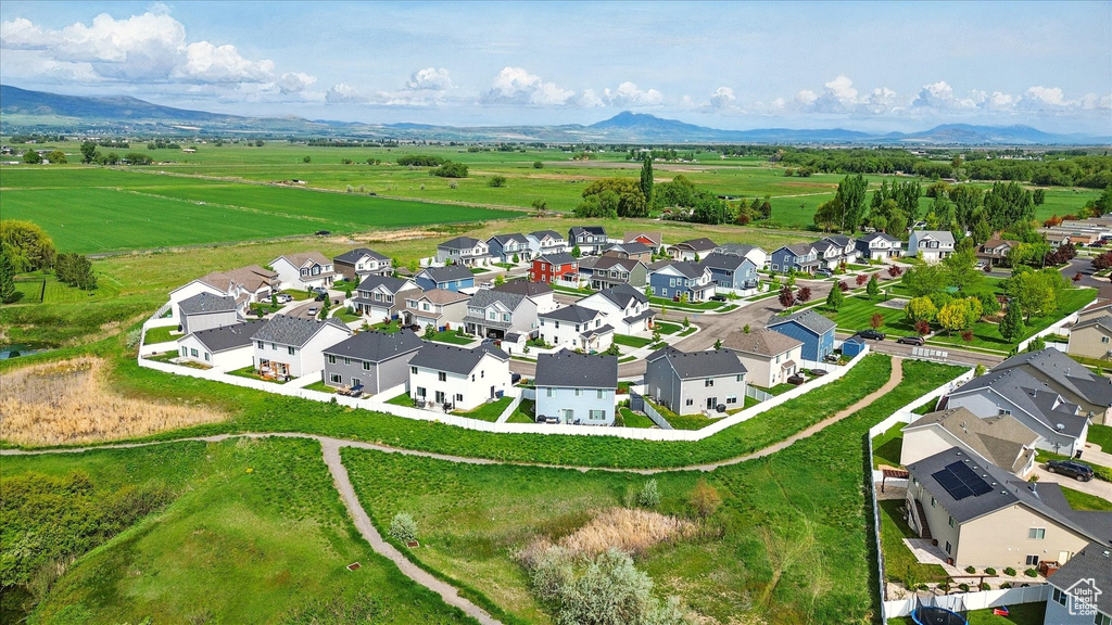 Aerial perspective of suburban area featuring a mountainous background