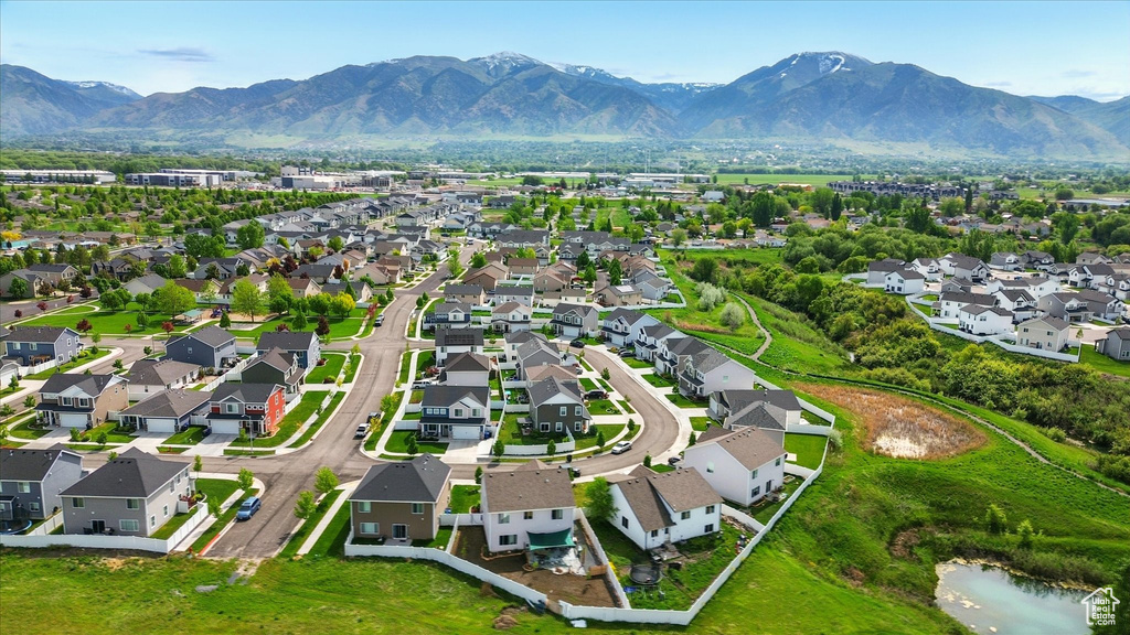 Aerial perspective of suburban area featuring a mountainous background