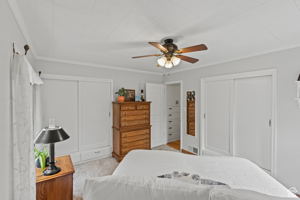 Bedroom featuring ornamental molding and a ceiling fan