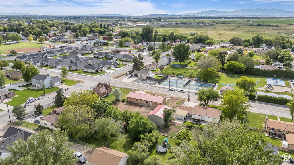 Aerial view of residential area featuring a mountain backdrop
