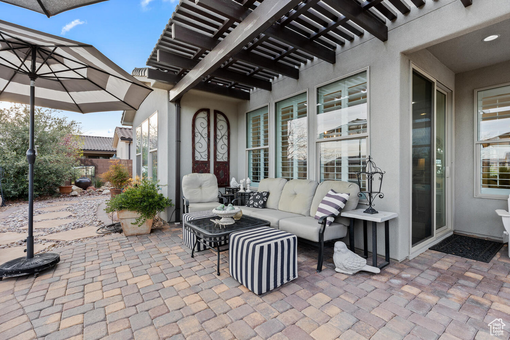 View of patio / terrace featuring a pergola and outdoor lounge area