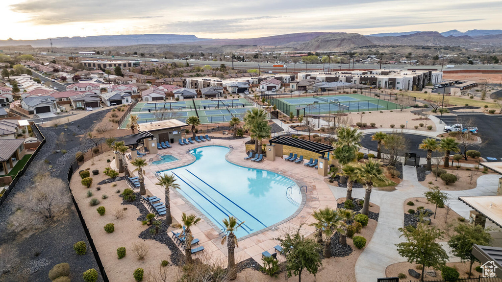 Aerial view of a mountainous background and a pool area