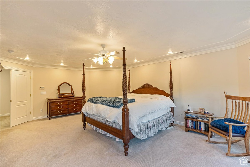 Bedroom featuring crown molding, recessed lighting, and light colored carpet