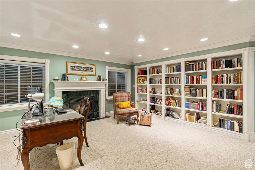 Living area with crown molding, carpet flooring, recessed lighting, baseboards, and a high end fireplace